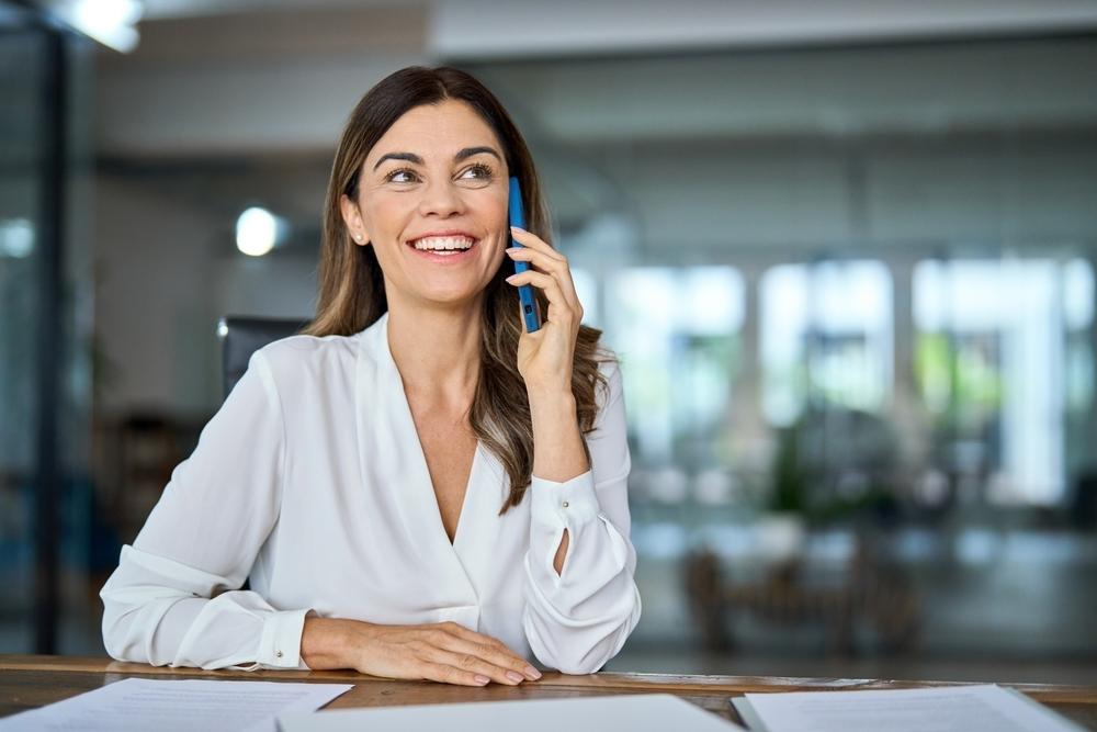 Woman smiling talking on the phone