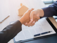 Shaking hands after signing a lease