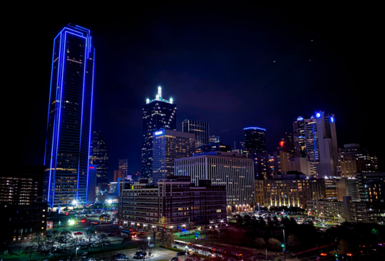 An aerial view of the skyline in Dallas, Texas at night.