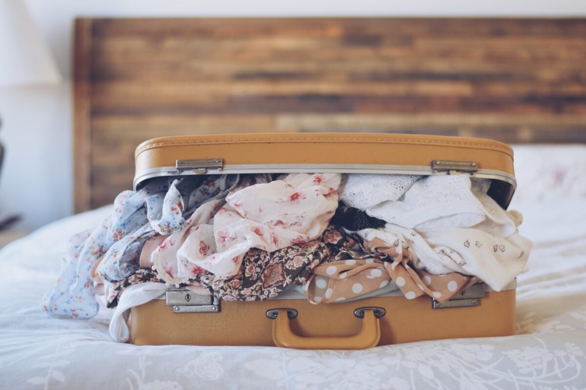 A suitcase on the bed.