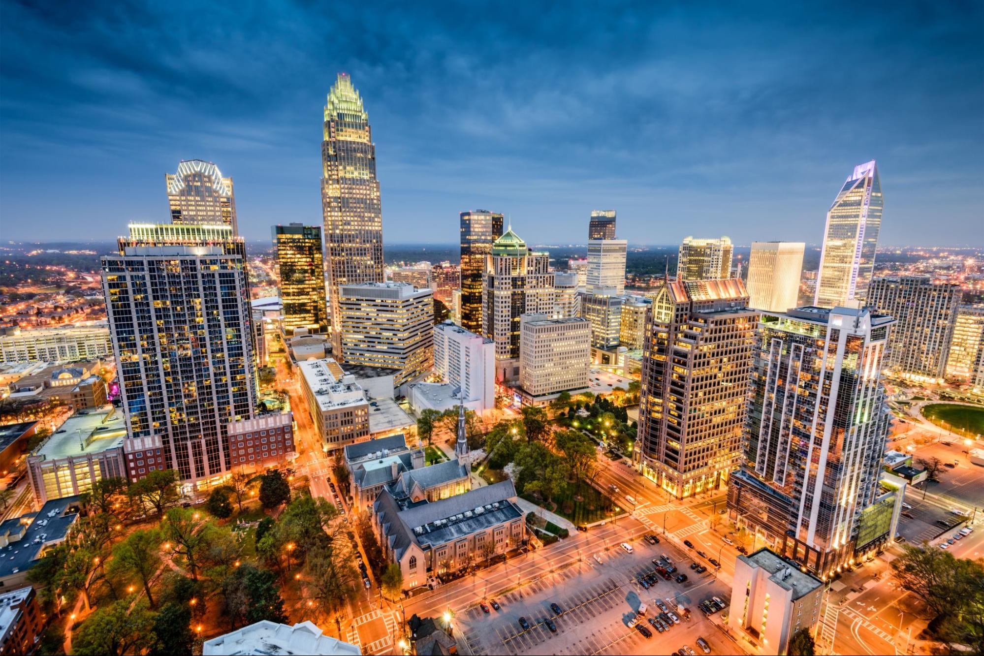 A birds-eye view of the city of Charlotte at nighttime.