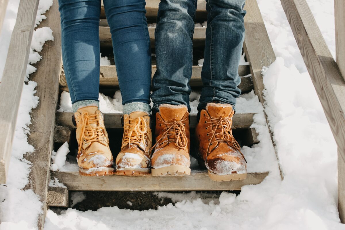 Couple wears winter boots together