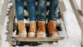 Couple wears winter boots together