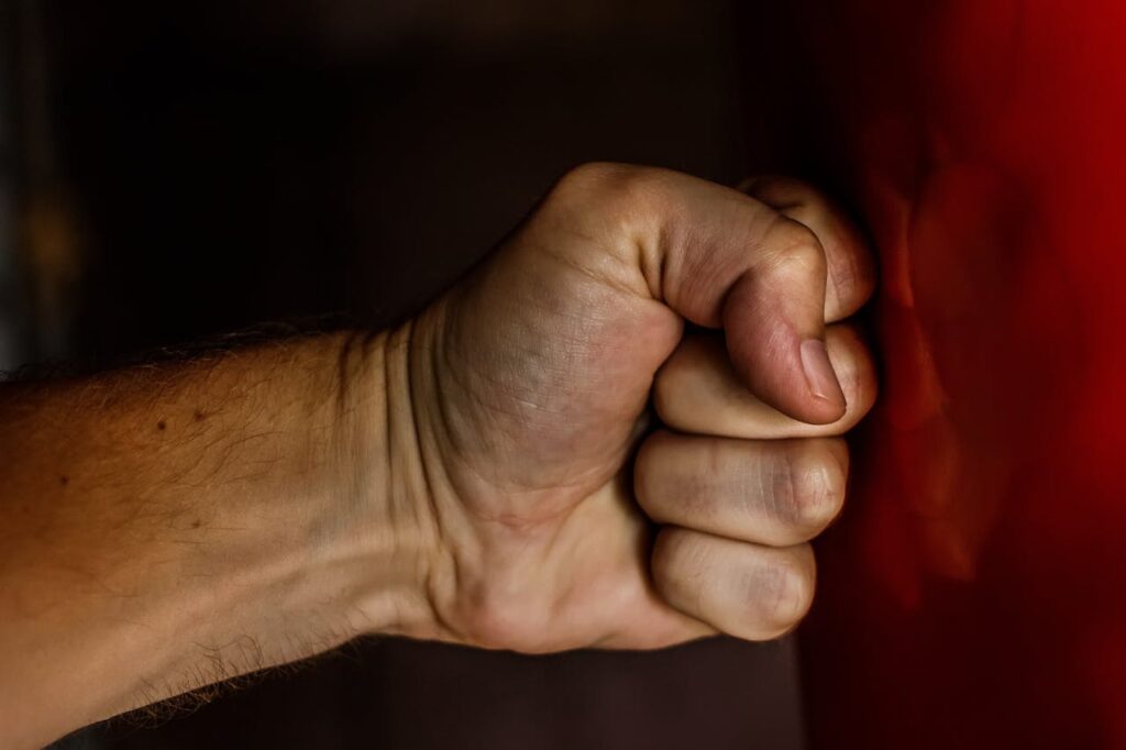 fist punching a wall