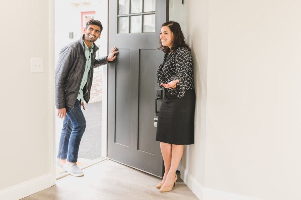 woman showing an apartment to a man