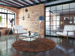 Modern loft apartment with exposed brick and chic furniture.