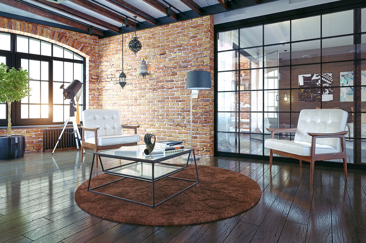 Modern loft apartment with exposed brick and chic furniture.