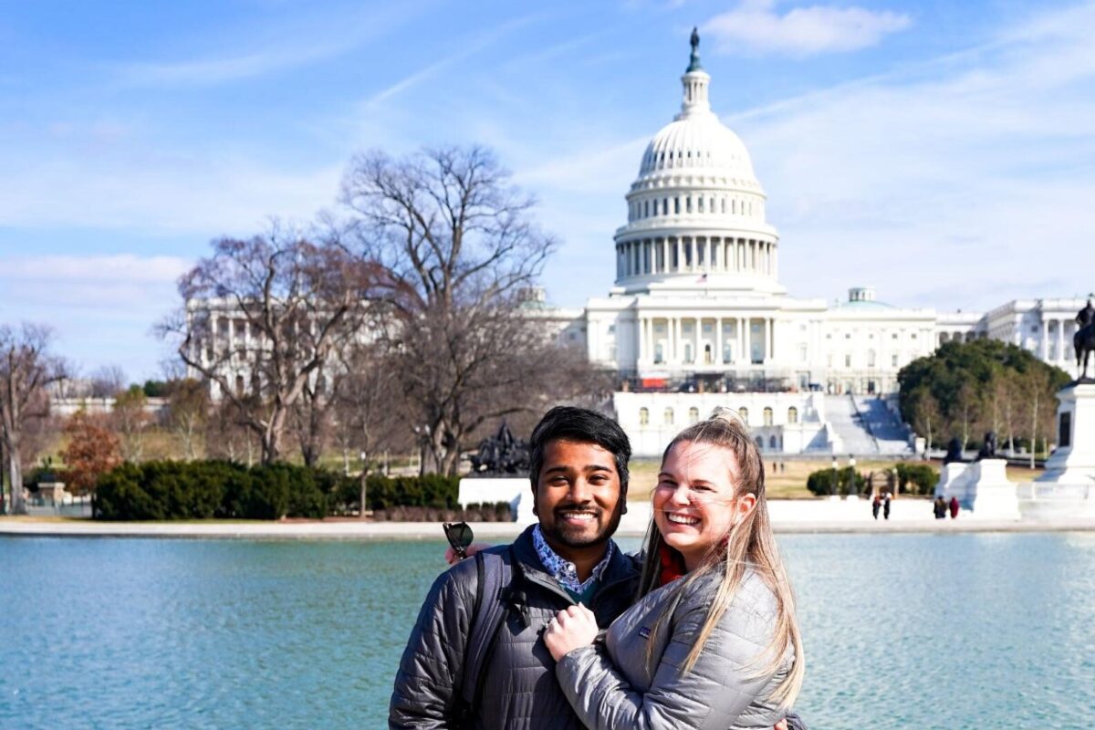 Digital nomads Madison and Ivan pose in front of the U.S. Capitol Building during their time in Washington, D.C.