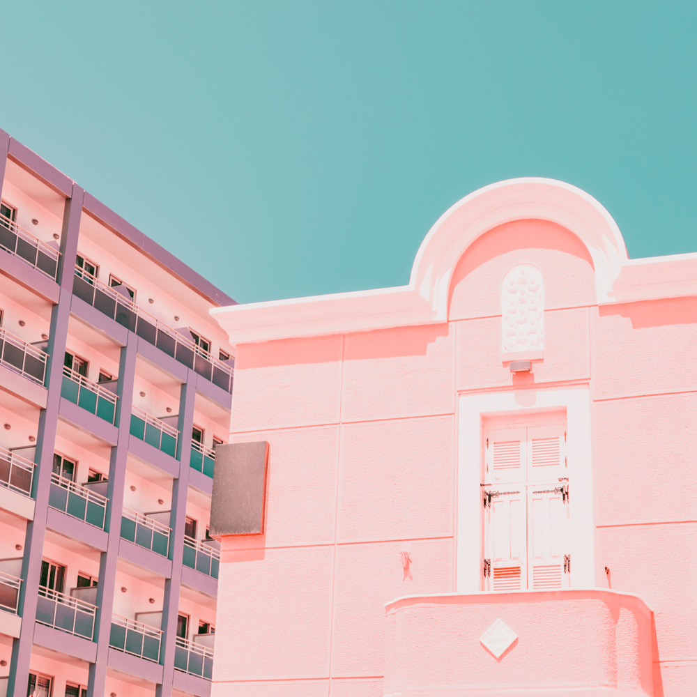 The geometric parts of the facade of the pink building and hotel. Minimalism
