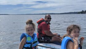 Landing member Dana Buck and his two kids on the water in the Pacific Northweset