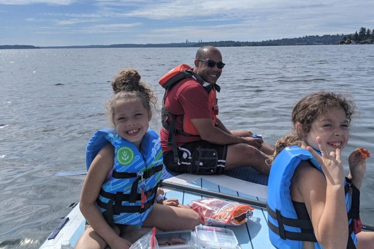 Landing member Dana Buck and his two kids on the water in the Pacific Northweset