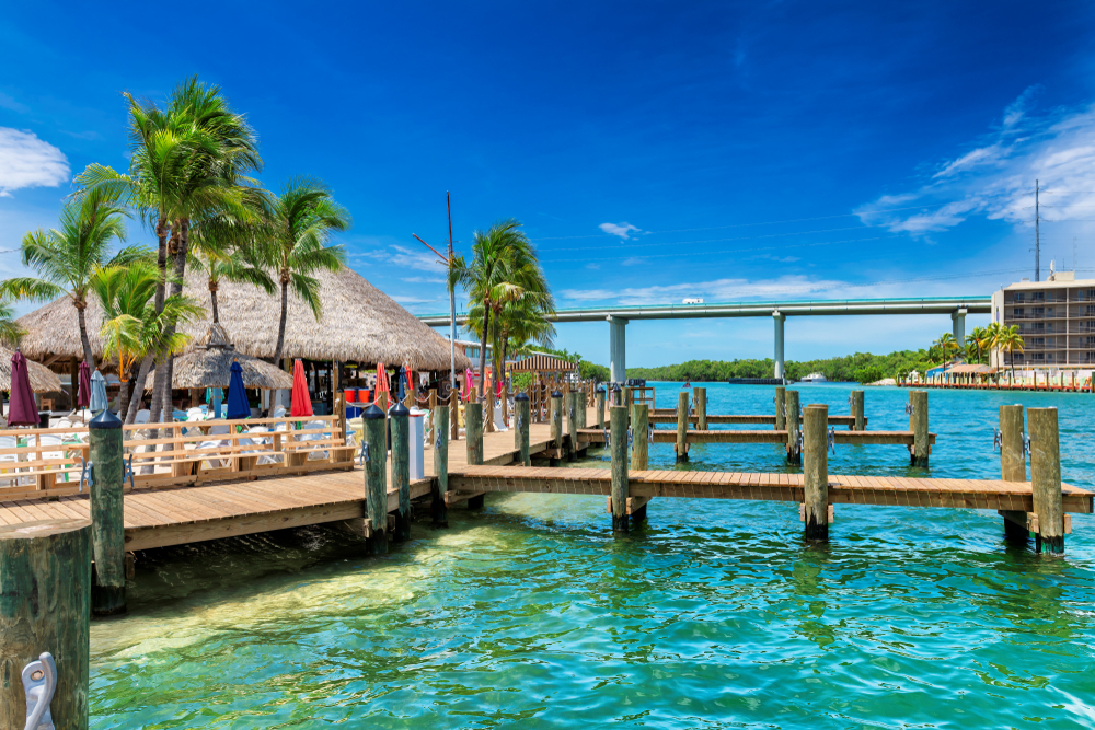 Tropical beach and pier on sunny beach in Key Largo, Florida keys islands. 