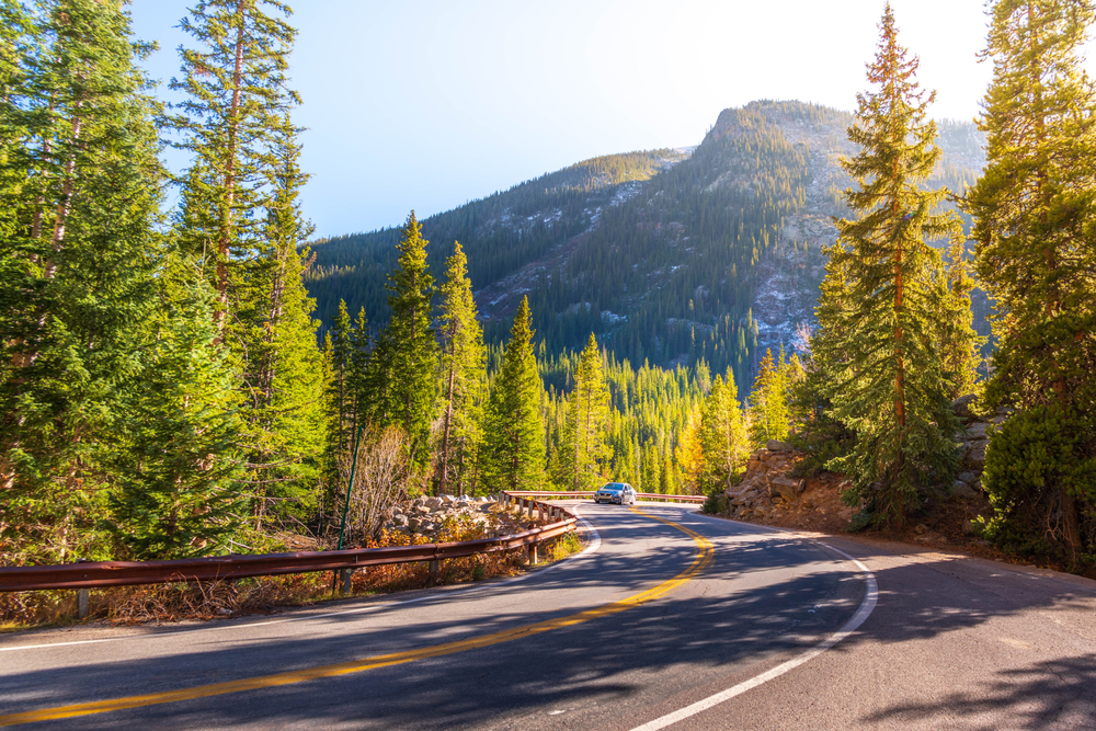 A car traveling along Winding Road Independence Pass Road Route 82, in autumn from Aspen Colorado.
