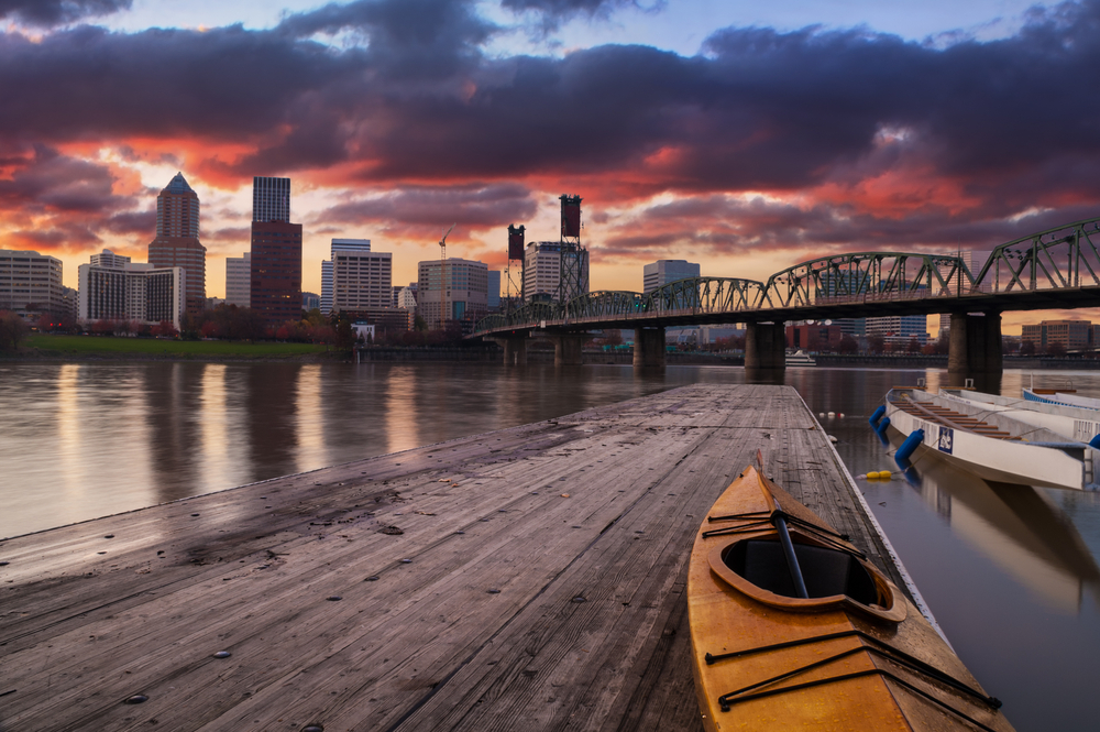 Portland, Oregon Panorama. Sunset scene with dramatic sky and light reflections on the Willamette River.
