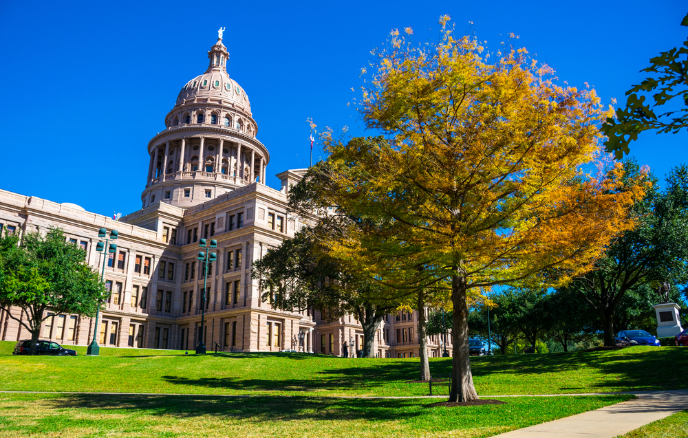 Texas State Capitol building during Fall Colors Autumn Season with Blue Sky Sunny gorgeous day in November Central Texas bliss Austin Texas USA