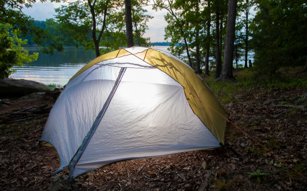 Tent set up with the water of Badin Lake in North Carolina behind