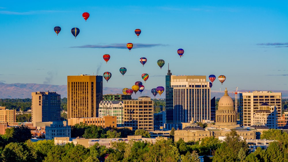 Capital and skyline of Boise Idaho with balloons in flight