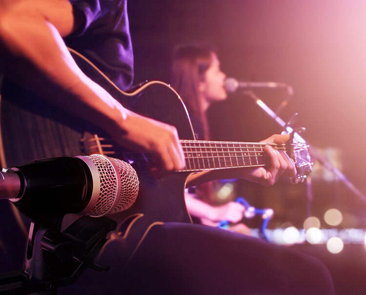 A guitarist takes the stage at a live music venue in Atlanta, GA.