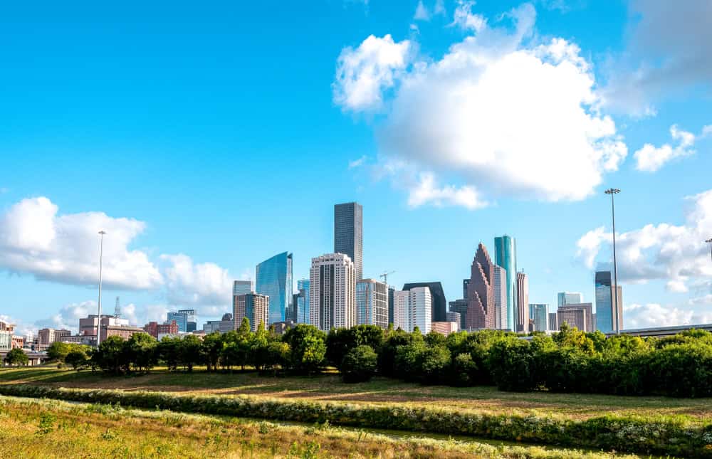 Houston skyline looking west from White Oak Bayou hike and bike trail on White Oak Bayou Houston Texas.