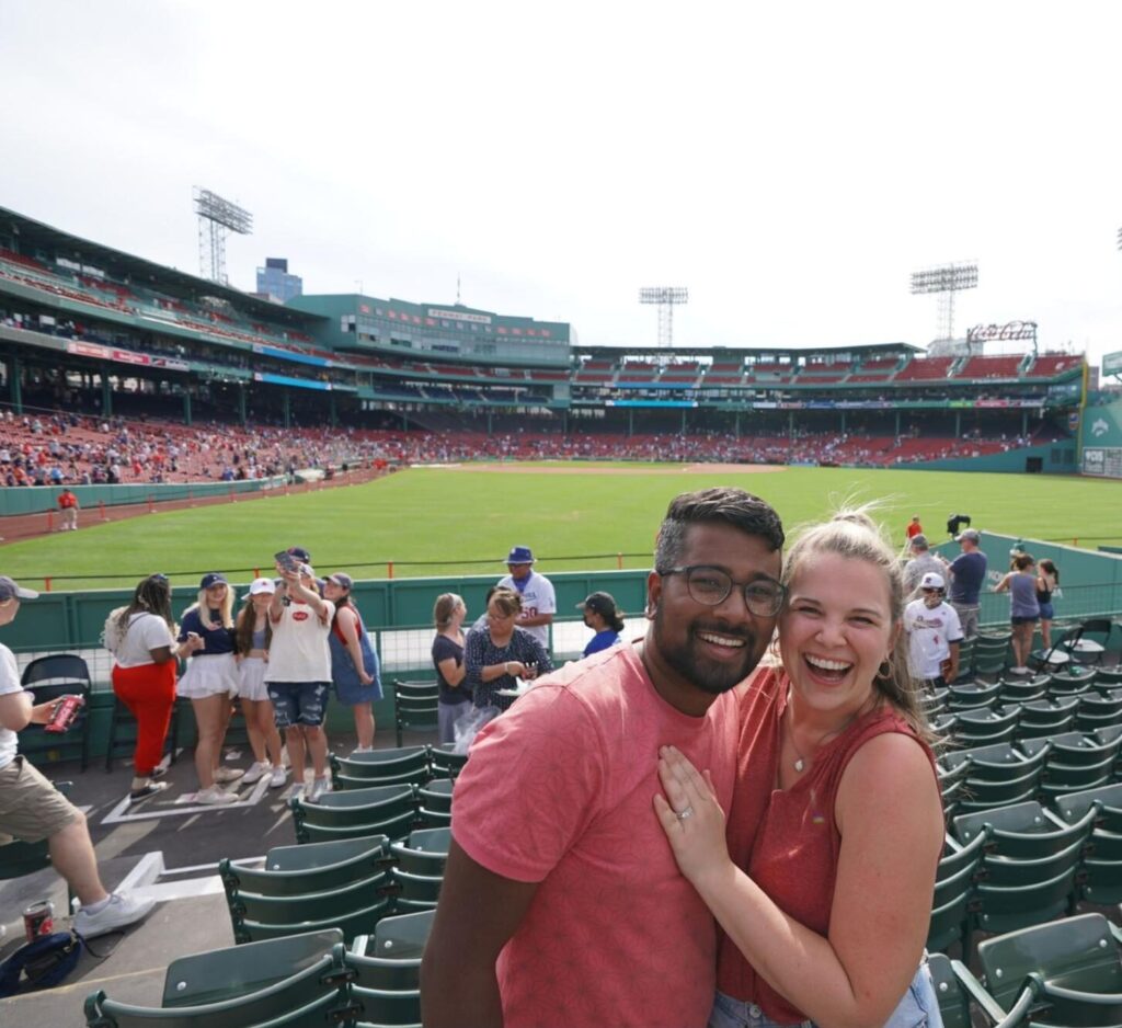 Madison and Ivan enjoy a Red Sox game at Fenway Park while living in Boston, Massachusetts.