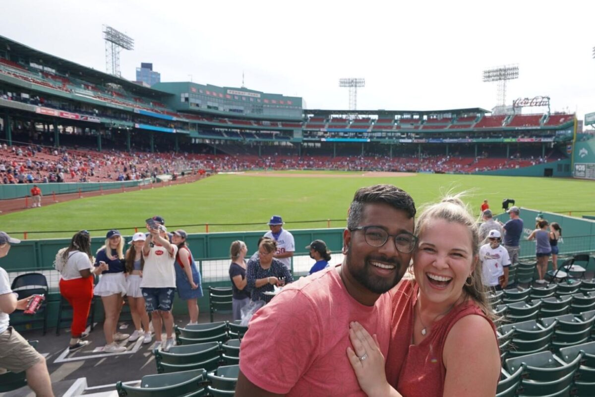 Madison and Ivan enjoy a Red Sox game at Fenway Park while living in Boston, Massachusetts.