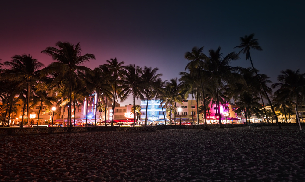 Ocean Drive street with illuminated buildings in Miami , Florida. Vintage colors