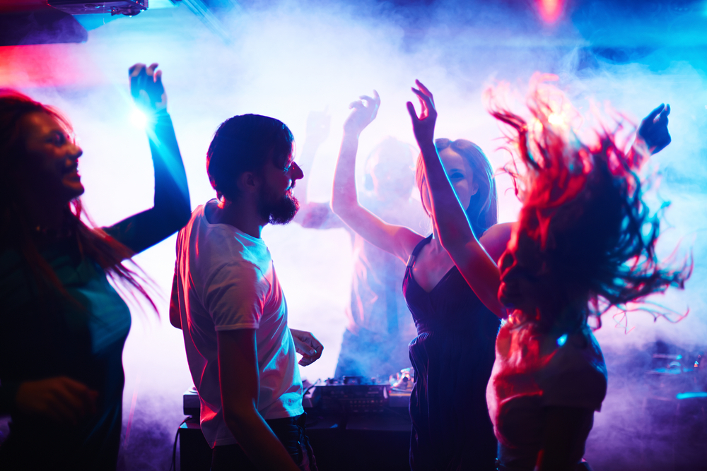 Young people dancing in nightclub