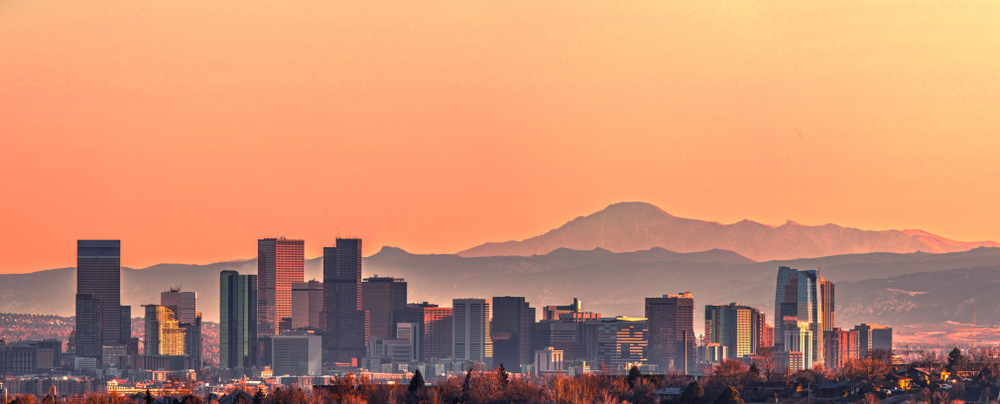Denver skyline and the Pikes Peak at sunset