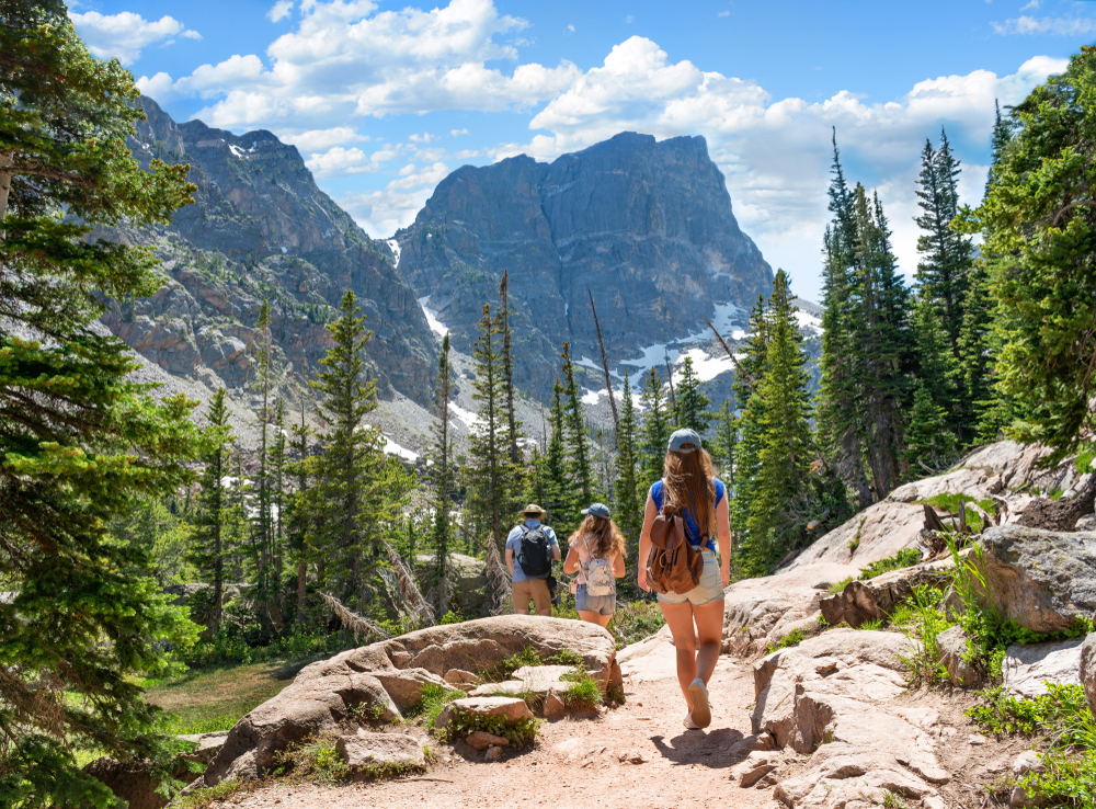 People hiking on Emerald Lake Trail at Rocky Mountains National Park