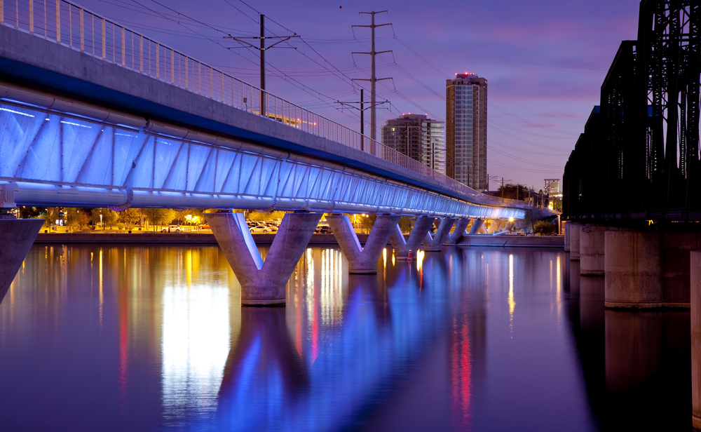 Phoenix Metro light rail bridge across the Salt River in Tempe Arizona photographed at sunset.