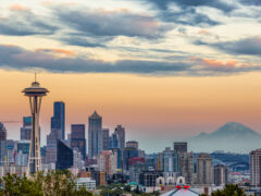 A photo of downtown Seattle and Mount Rainier at sunset.