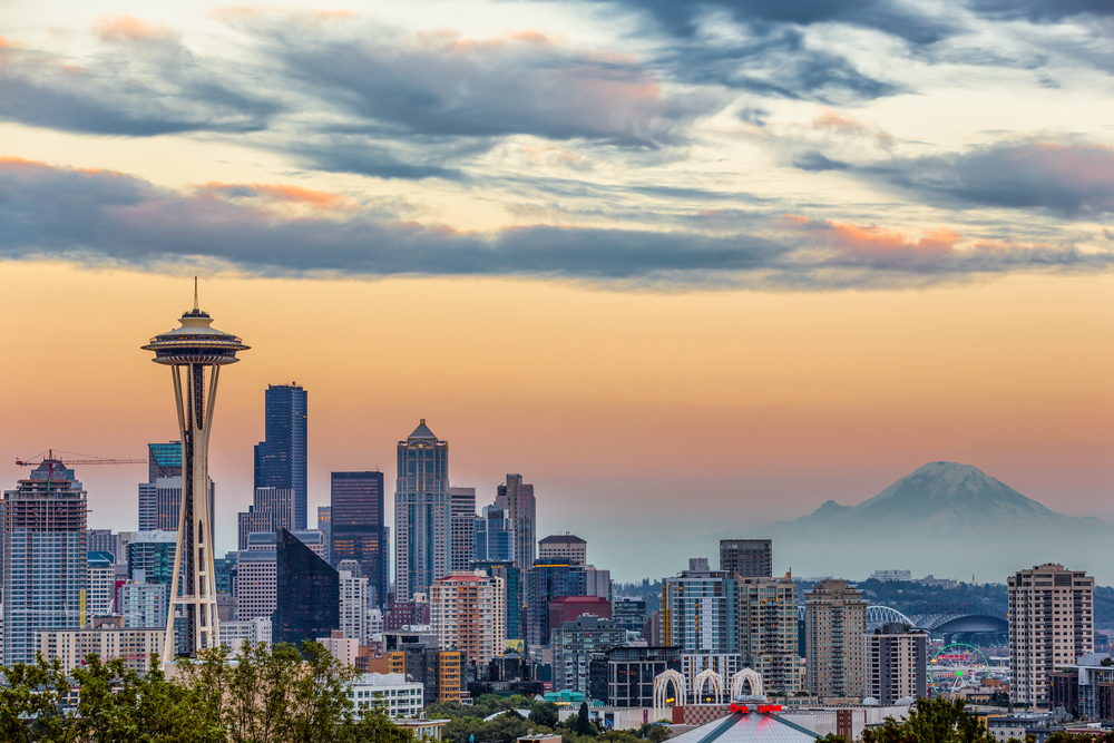 A photo of downtown Seattle and Mount Rainier at sunset.