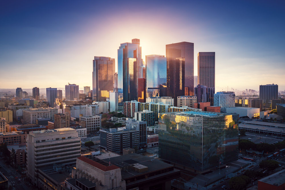 Sunset over Los Angeles downtown. Retro colors. California theme. LA background. Los Angeles city center. Sunset over Los Angeles downtown. Retro colors. California theme. LA background. Los Angeles city center.