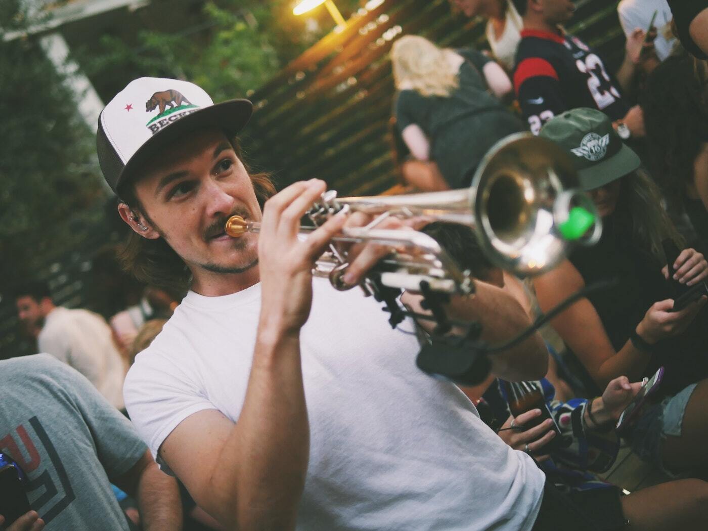 Man plays trumpet in Austin, which is known for its amazing live music scene.
