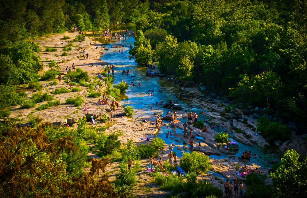 Austin texas greenbelt summer crowds enjoying the cold springs Barton creek