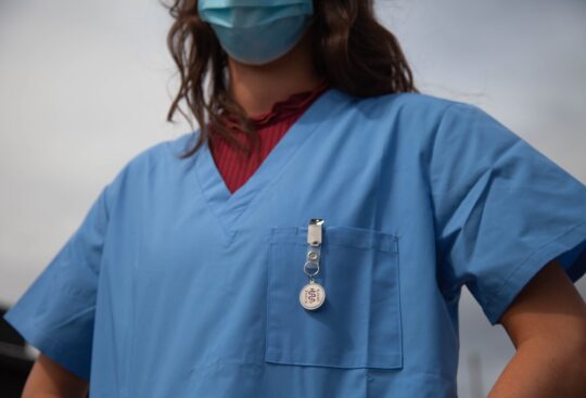 Travel nurse wearing scrubs