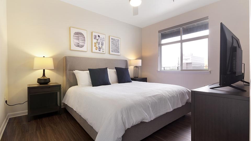 Bedroom with three paintings