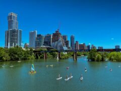 Summer time on Lady Bird Lake with the downtown Austin, Texas city skyline in the background.