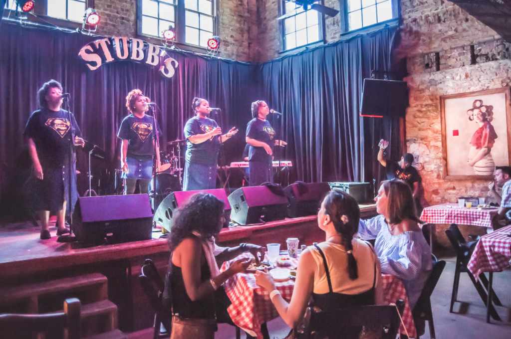 Group of four women singing at Stubb's, Austin, Texas