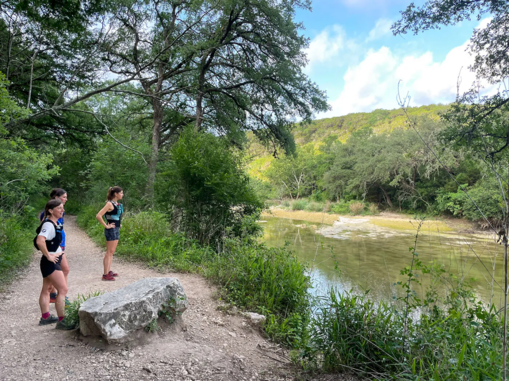 Three women hiking at Barton Creek Greenbelt