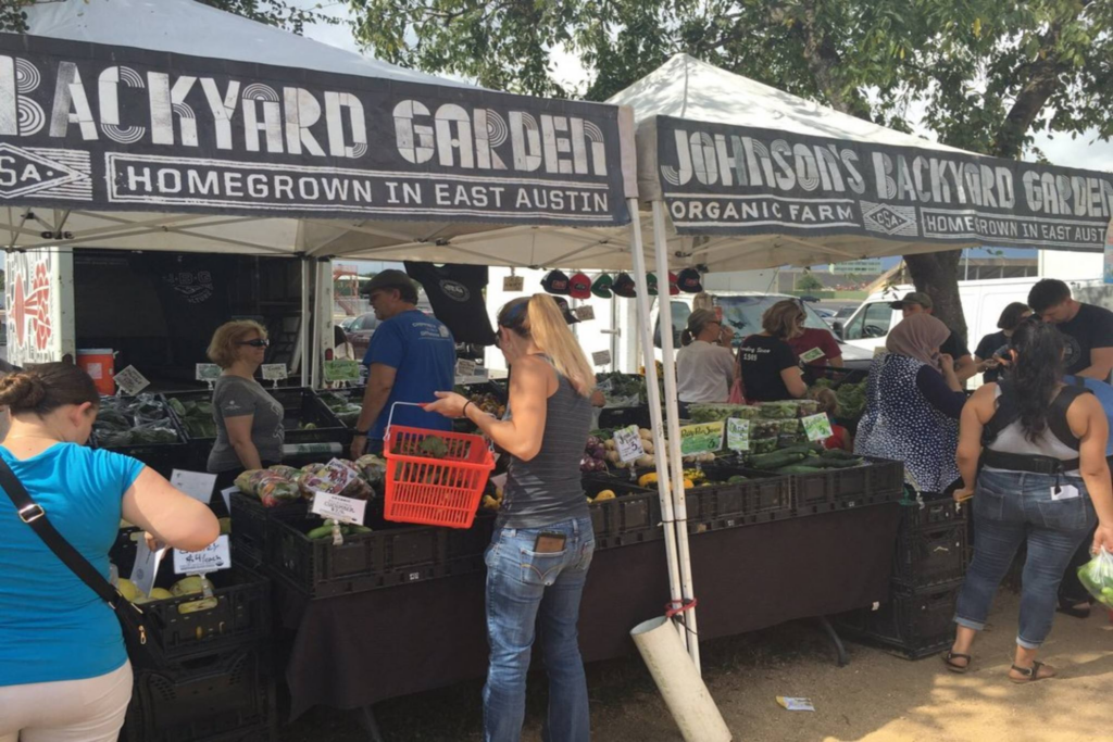 People shopping for fruits and vegetables at SFC Farmers’ Market Sunset Valley