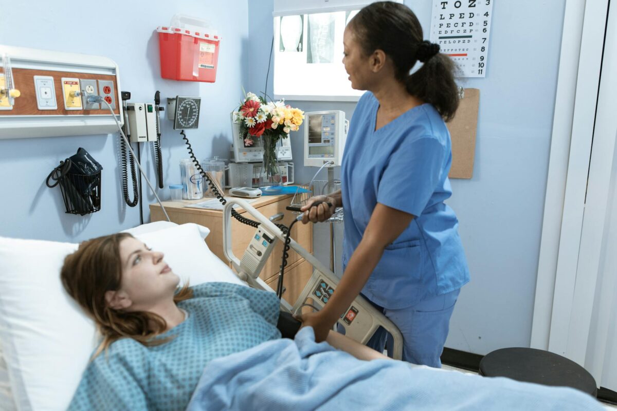 Female nurse measuring the pressure of a hospitalized patient