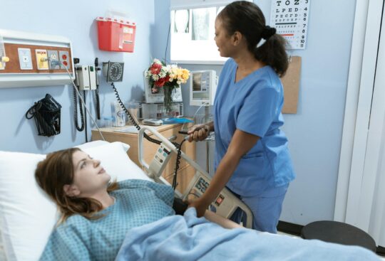 Female nurse measuring the pressure of a hospitalized patient