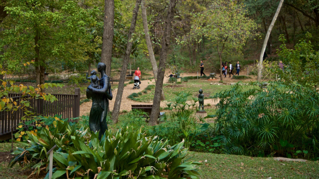 Families strolling around and visiting Umalauf Sculpture Garden