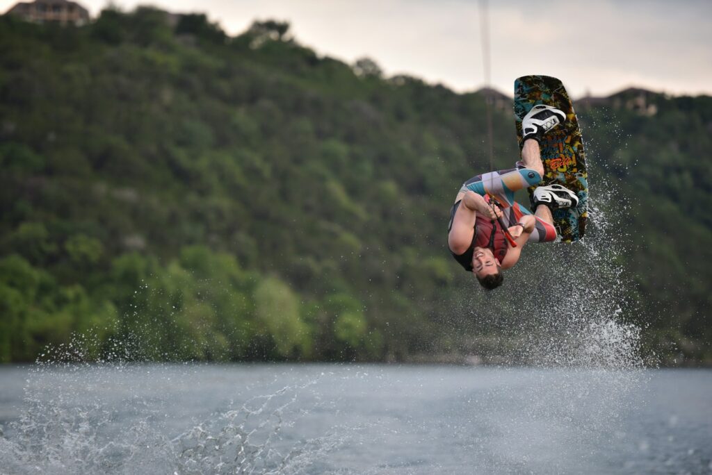 Person on wakeboard flipping at Lake Austin