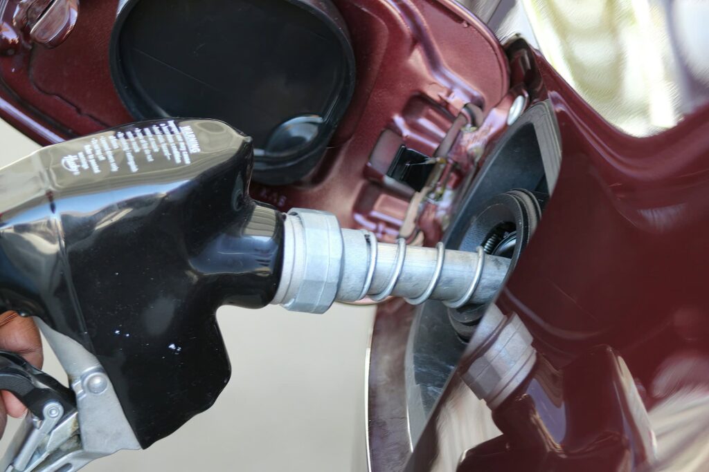 pouring gasoline into a car