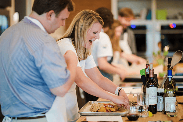 A couple cooking at Chef Alyssa's Kitchen