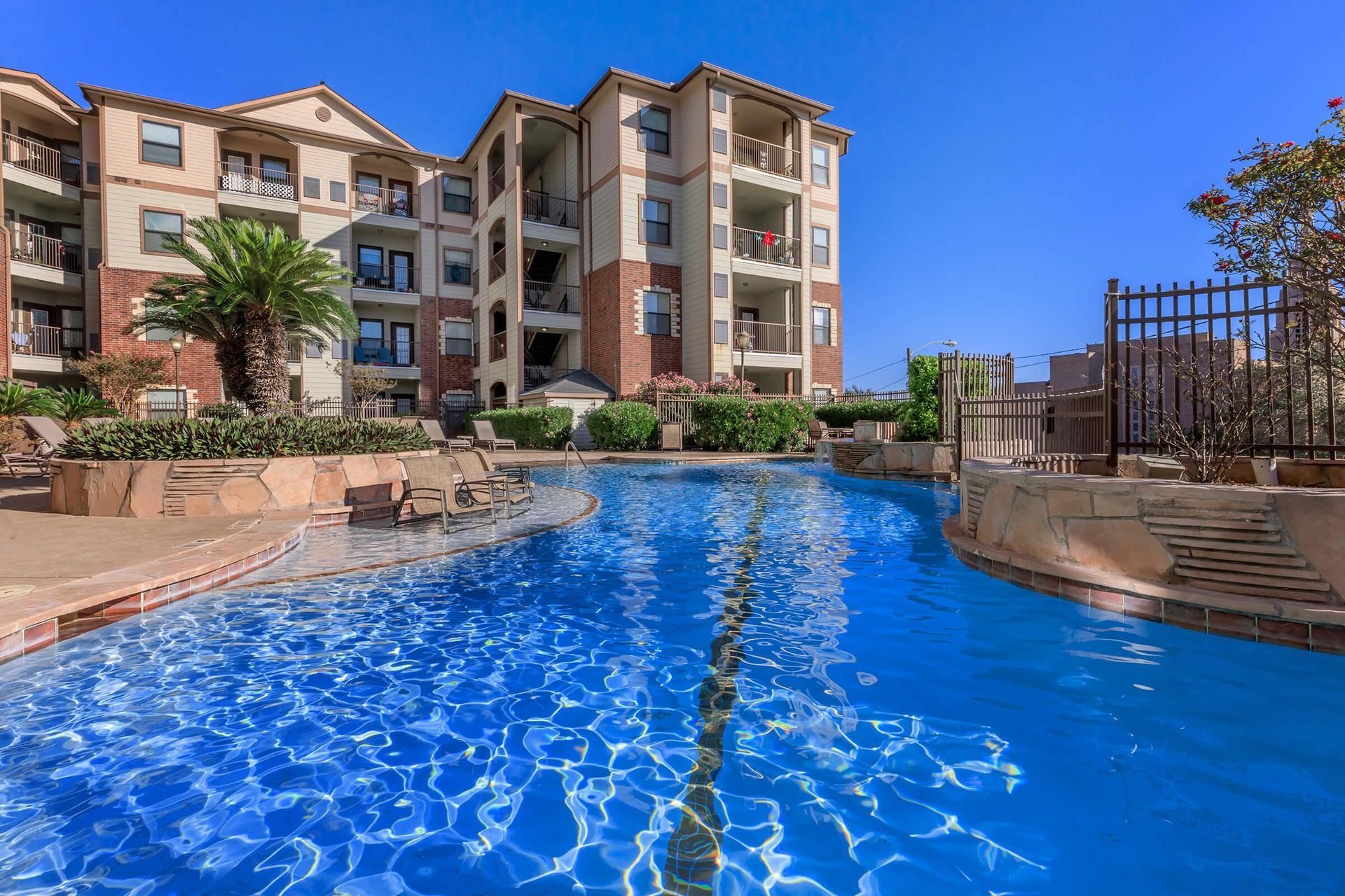 Pool with palm trees at Bay Vista in downtown Corpus Christi, Texas